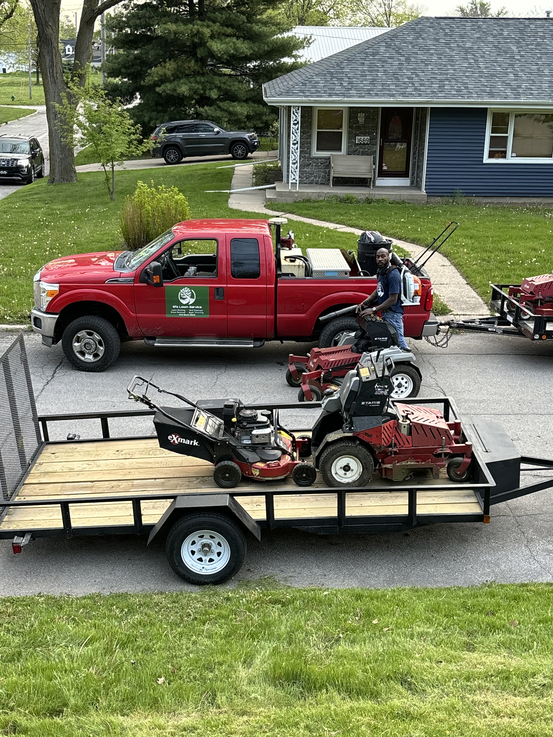 Grass Mower Working in Garden